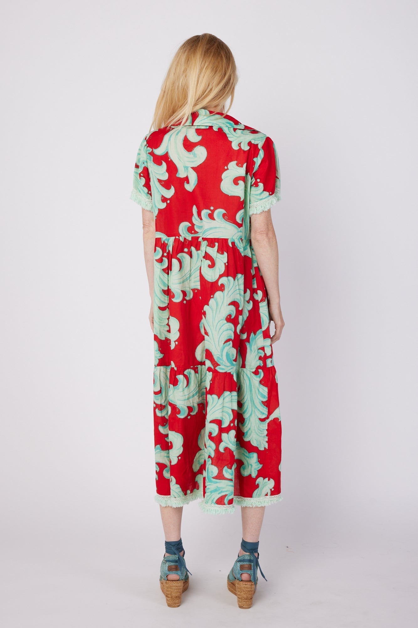 ModaPosa Cadenza Short Sleeve Midi Dress with Collar and Fringe Trim in Crimson Mist Baroque . Discover women's resort dresses and lifestyle clothing inspired by the Mediterranean. Free worldwide shipping available!