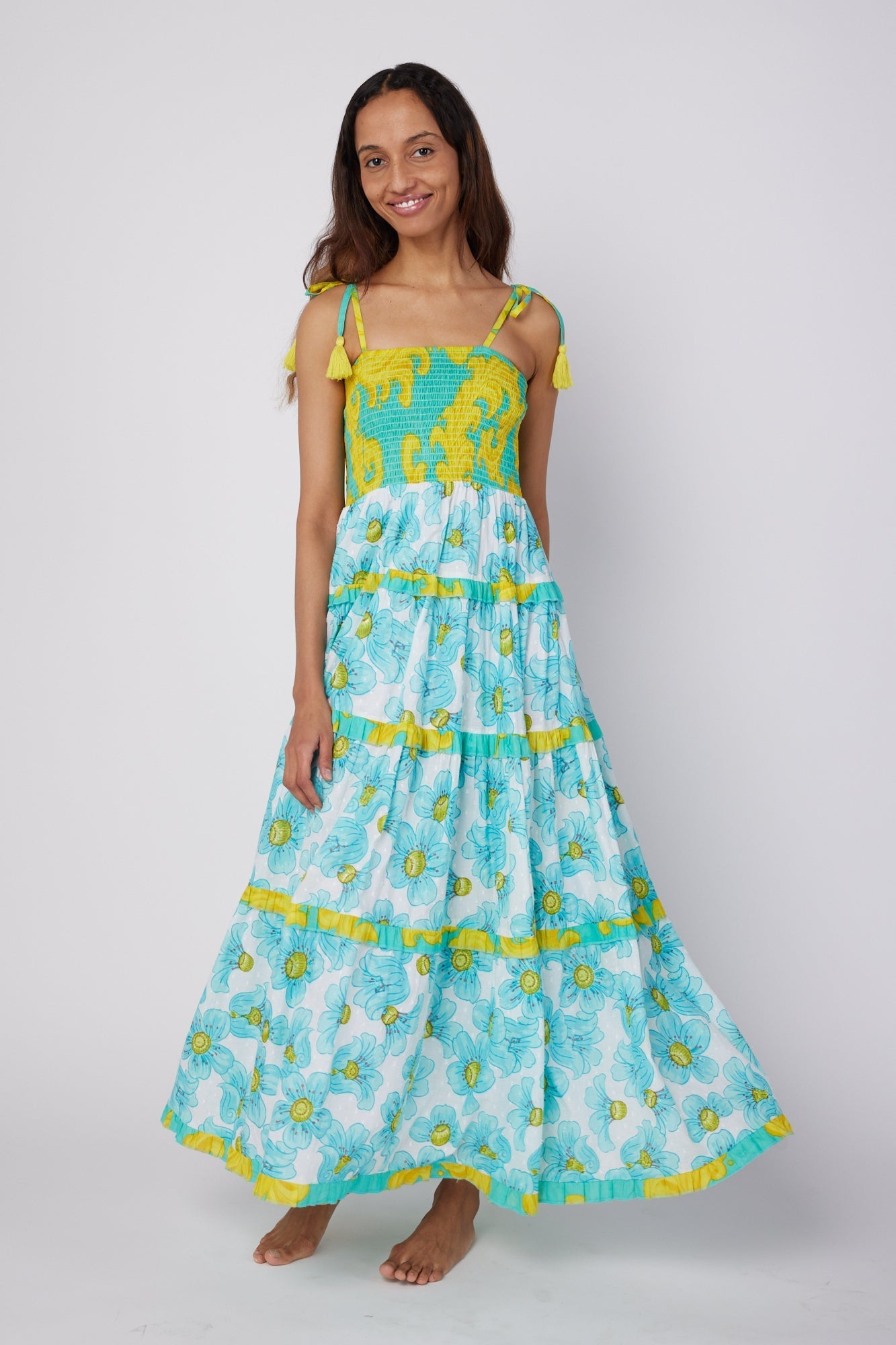 ModaPosa Dianora Spaghetti Strap Smocked Tiered Maxi Dress in Golden Floral Combo . Discover women's resort dresses and lifestyle clothing inspired by the Mediterranean. Free worldwide shipping available!