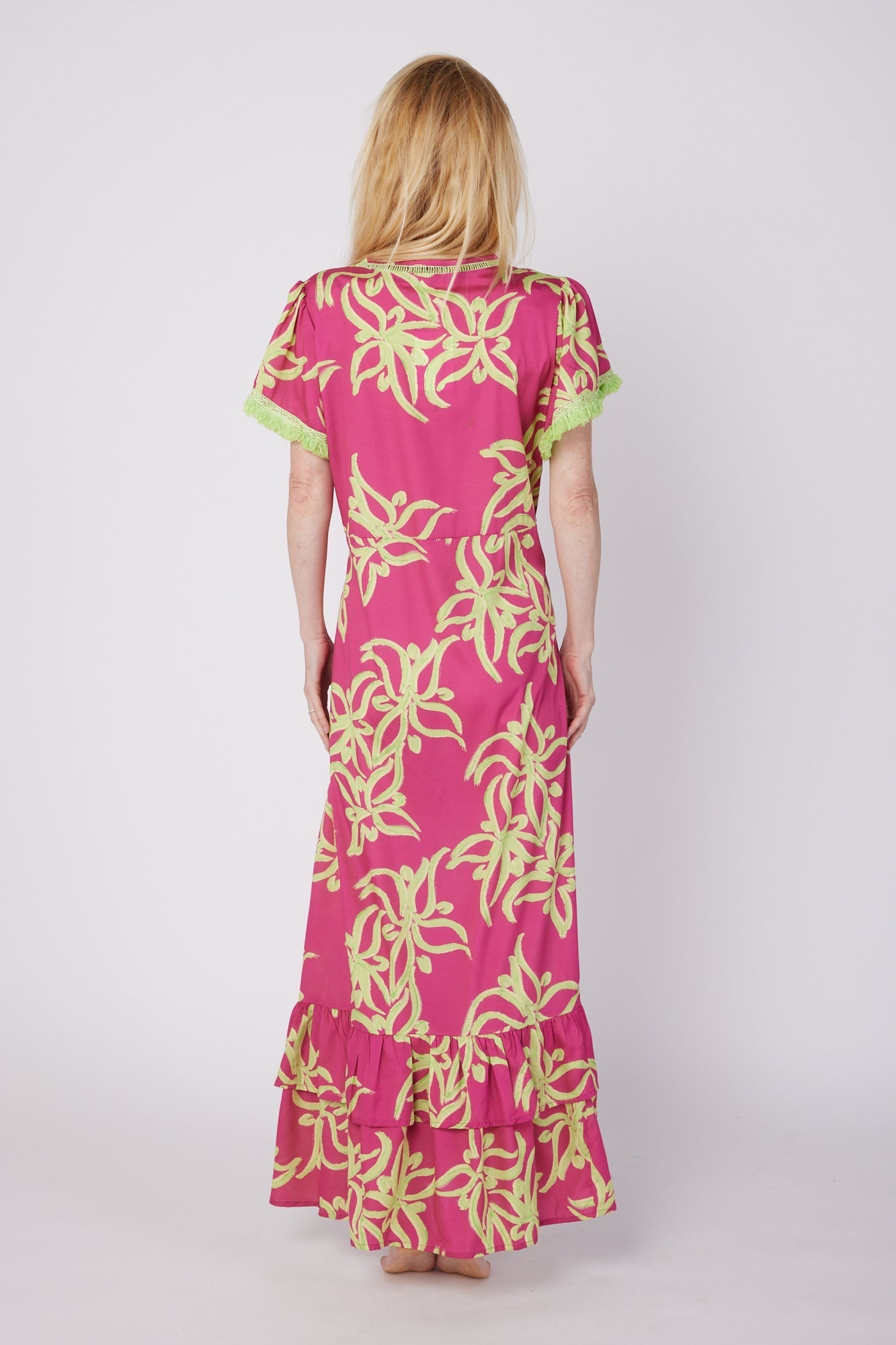 ModaPosa Brigida Short Sleeve V-Neck Maxi Dress with Fringe Trim in in Raspberry Lime Flower . Discover women's resort dresses and lifestyle clothing inspired by the Mediterranean. Free worldwide shipping available!