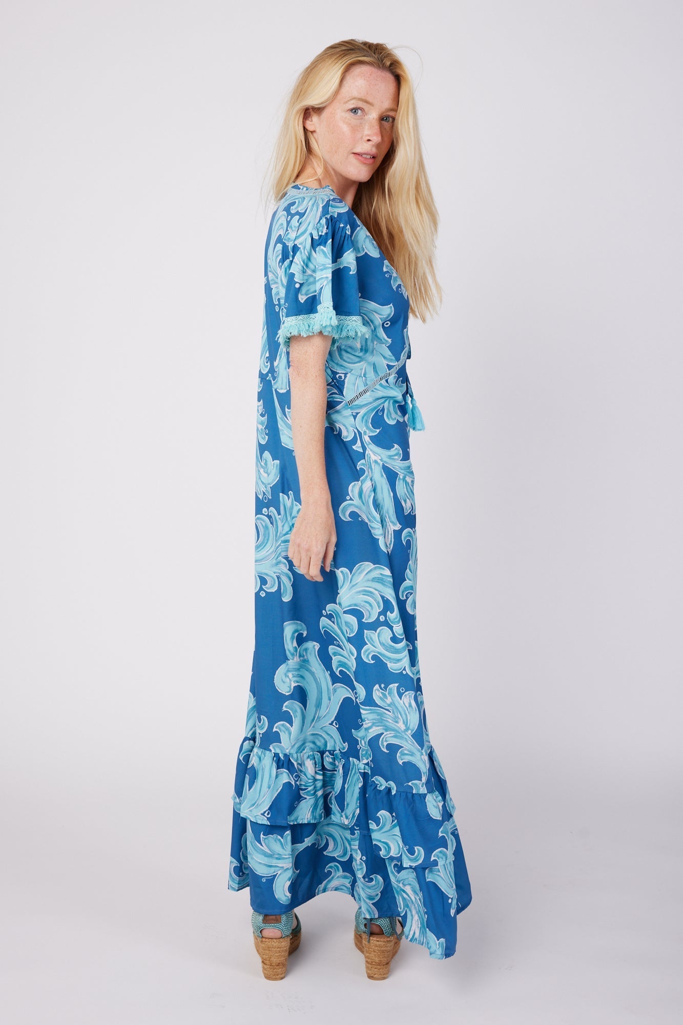 ModaPosa Brigida Short Sleeve V-Neck Maxi Dress with Fringe Trim in in Deep Blue Baroque . Discover women's resort dresses and lifestyle clothing inspired by the Mediterranean. Free worldwide shipping available!