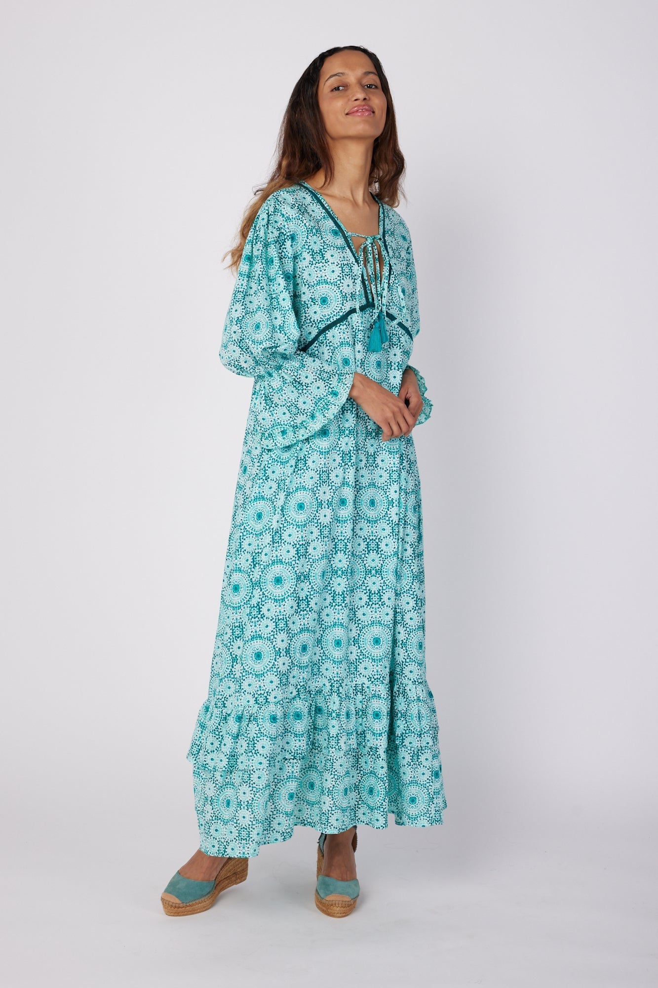 ModaPosa Brigida Ruffle Sleeve Swiss Dot V-Neck Maxi Dress in Moroccan Tile . Discover women's resort dresses and lifestyle clothing inspired by the Mediterranean. Free worldwide shipping available!