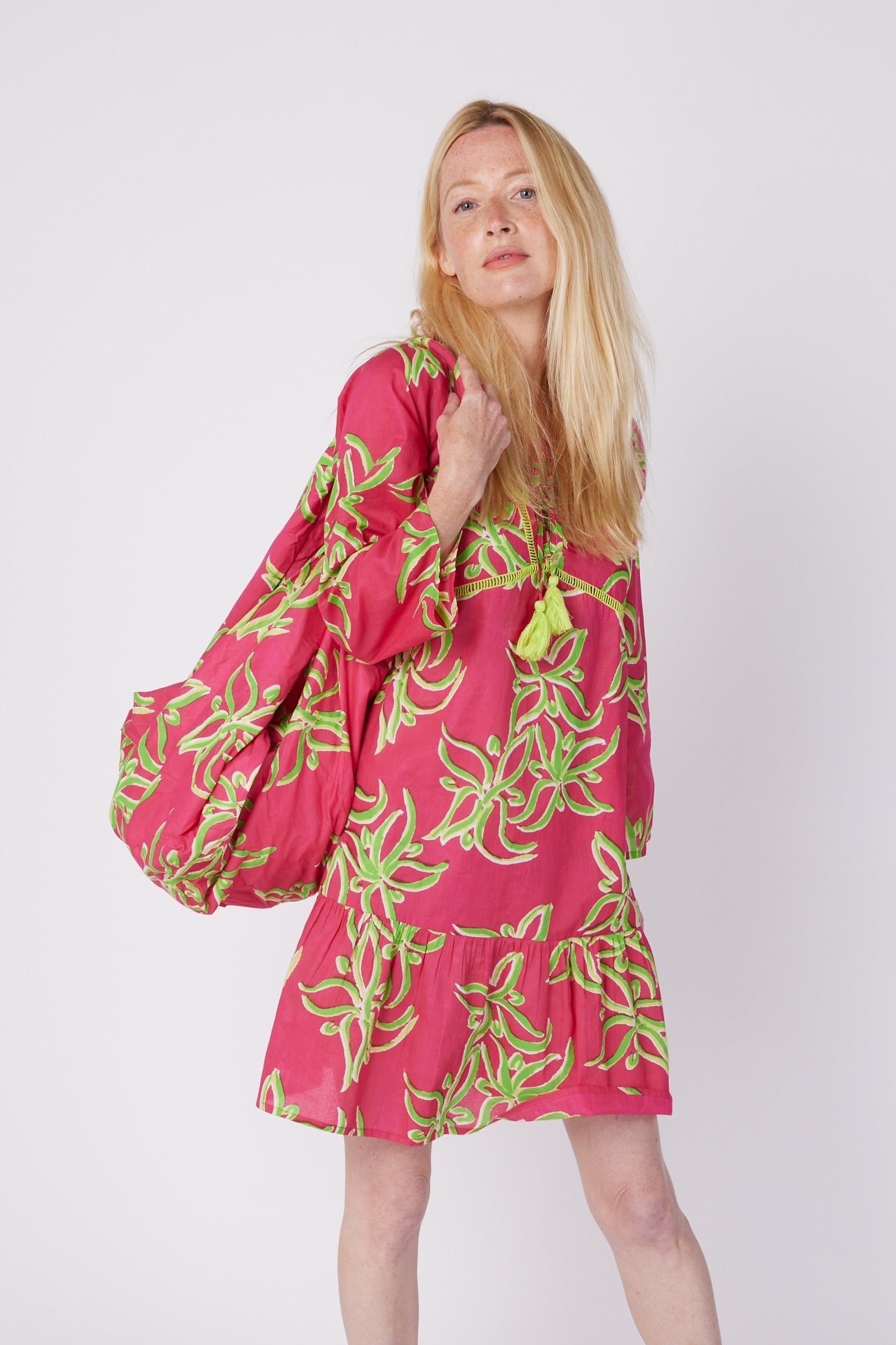 ModaPosa Brigida 3/4 Sleeve Ruffle Knee Length V-Neck Dress in Raspberry Lime Flower . Discover women's resort dresses and lifestyle clothing inspired by the Mediterranean. Free worldwide shipping available!