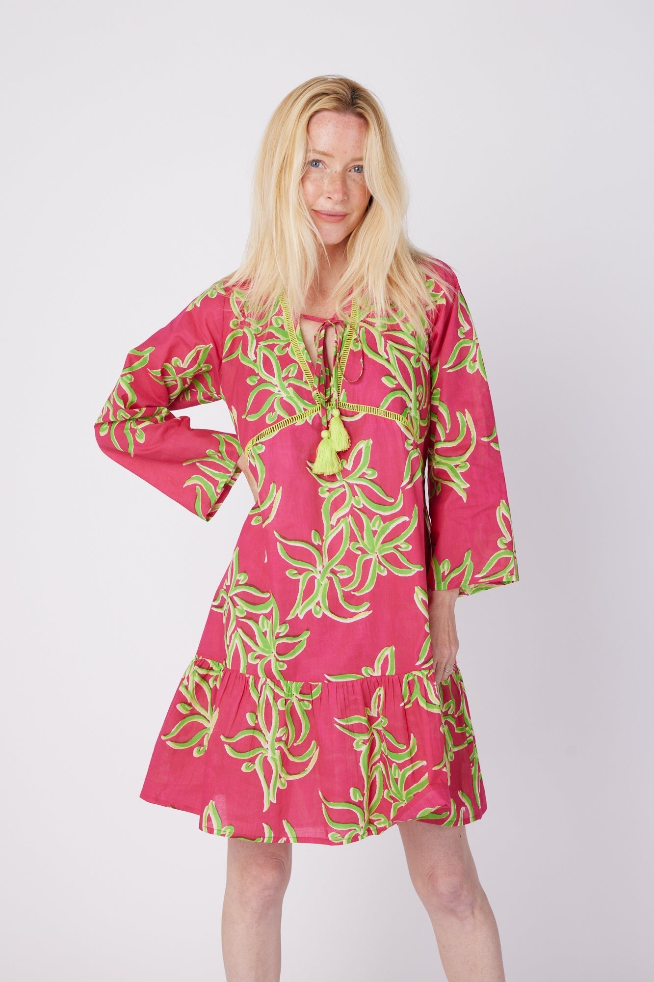 ModaPosa Brigida 3/4 Sleeve Ruffle Knee Length V-Neck Dress in Raspberry Lime Flower . Discover women's resort dresses and lifestyle clothing inspired by the Mediterranean. Free worldwide shipping available!