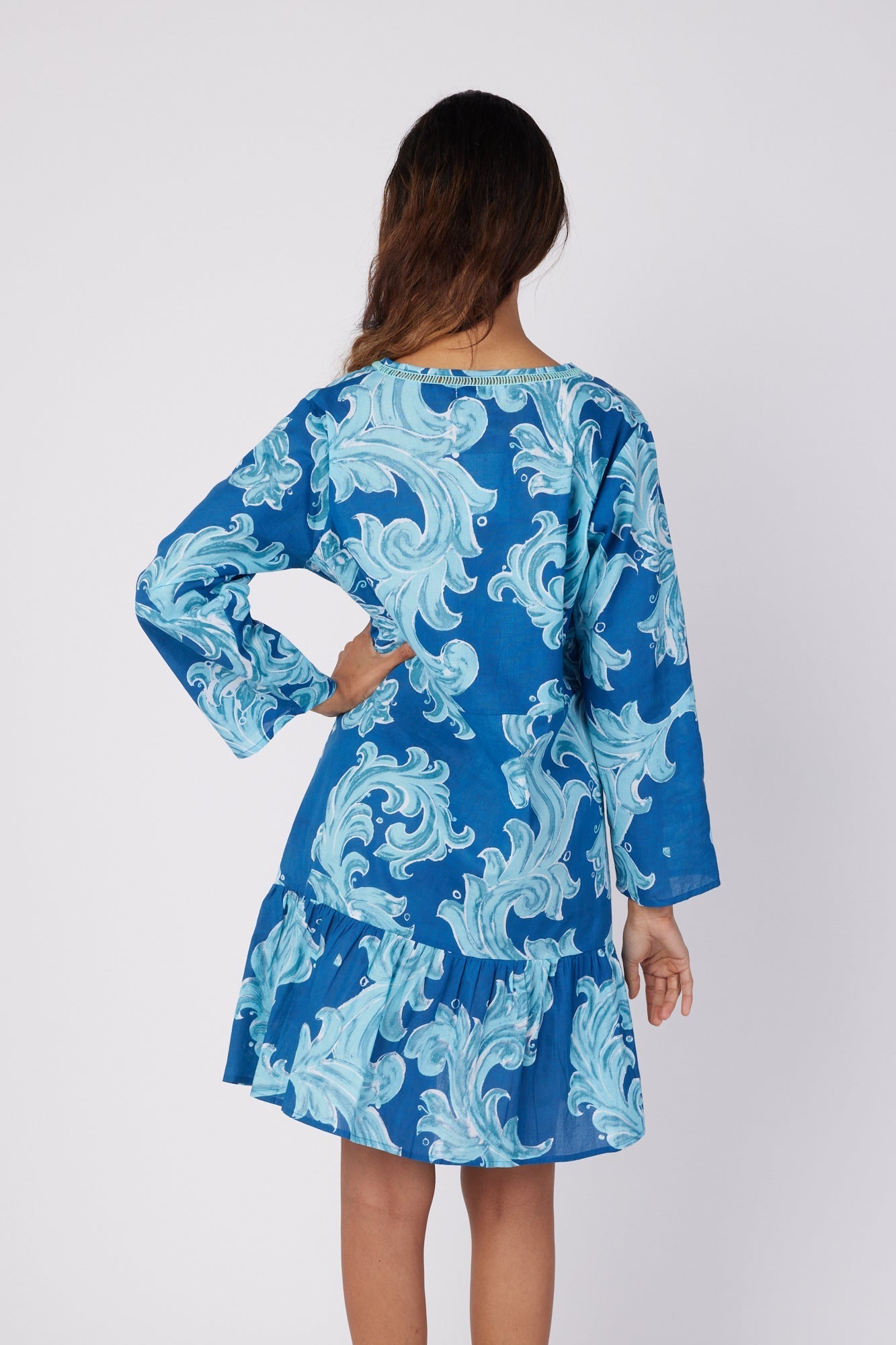ModaPosa Brigida 3/4 Sleeve Ruffle Knee Length V-Neck Dress in Deep Blue Baroque . Discover women's resort dresses and lifestyle clothing inspired by the Mediterranean. Free worldwide shipping available!