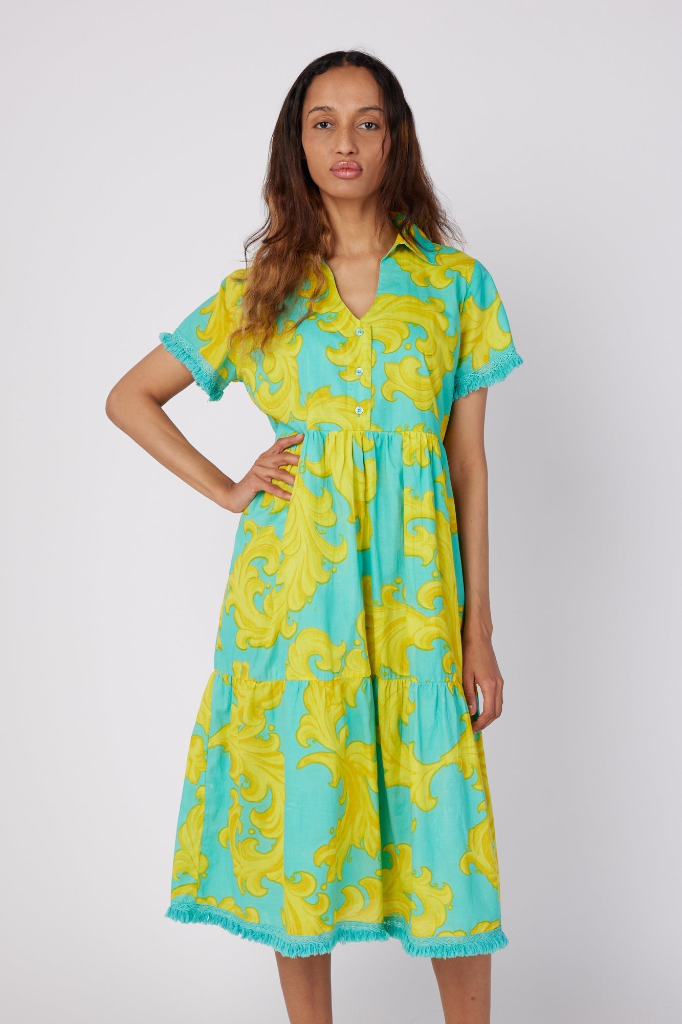 ModaPosa Cadenza Short Sleeve Midi Dress with Collar and Fringe Trim in Golden Baroque . Discover women's resort dresses and lifestyle clothing inspired by the Mediterranean. Free worldwide shipping available!