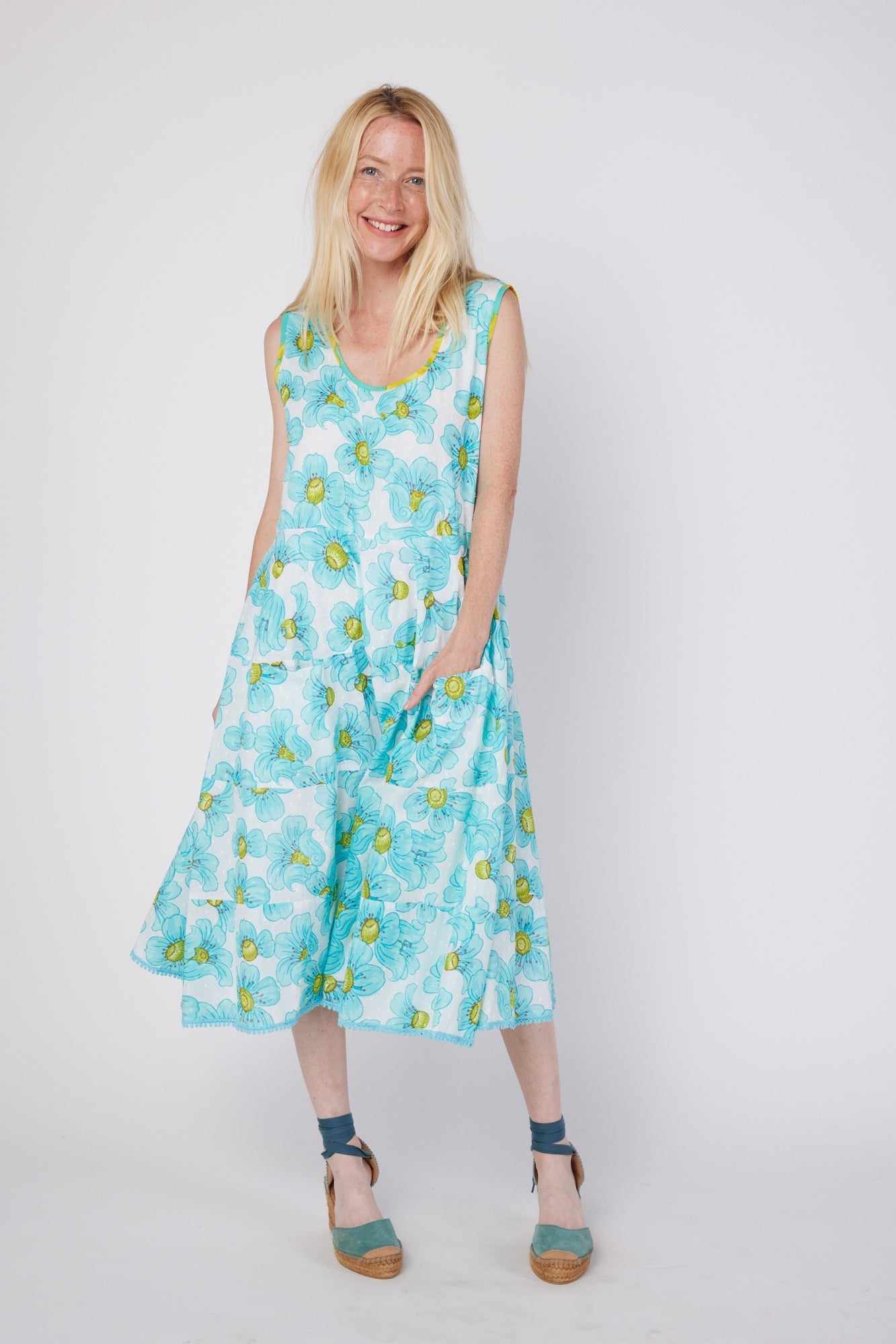 ModaPosa Karysa Sleeveless Tiered Scoop Neck Midi Sundress with Pockets in Blue Floral . Discover women's resort dresses and lifestyle clothing inspired by the Mediterranean. Free worldwide shipping available!