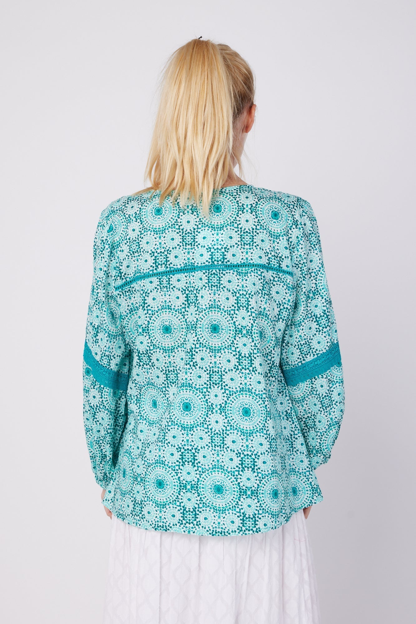 ModaPosa Leola Puff Sleeve Tassel Blouse with Lace Trim in Moroccan Tile . Discover women's resort dresses and lifestyle clothing inspired by the Mediterranean. Free worldwide shipping available!