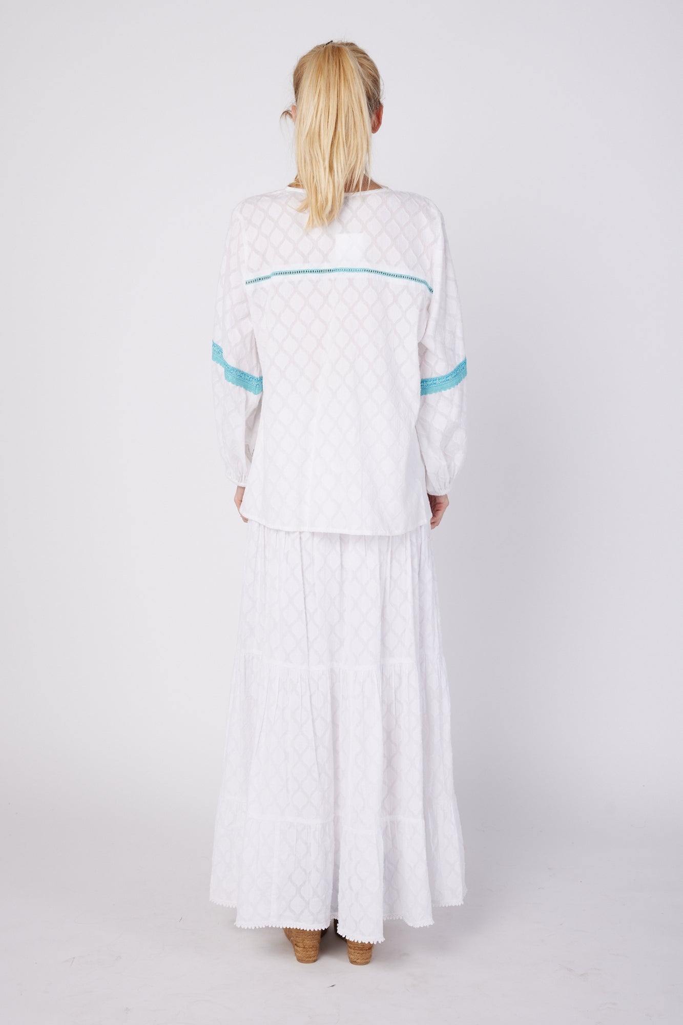 ModaPosa Leola Puff Sleeve Tassel Blouse with Lace Trim in White . Discover women's resort dresses and lifestyle clothing inspired by the Mediterranean. Free worldwide shipping available!