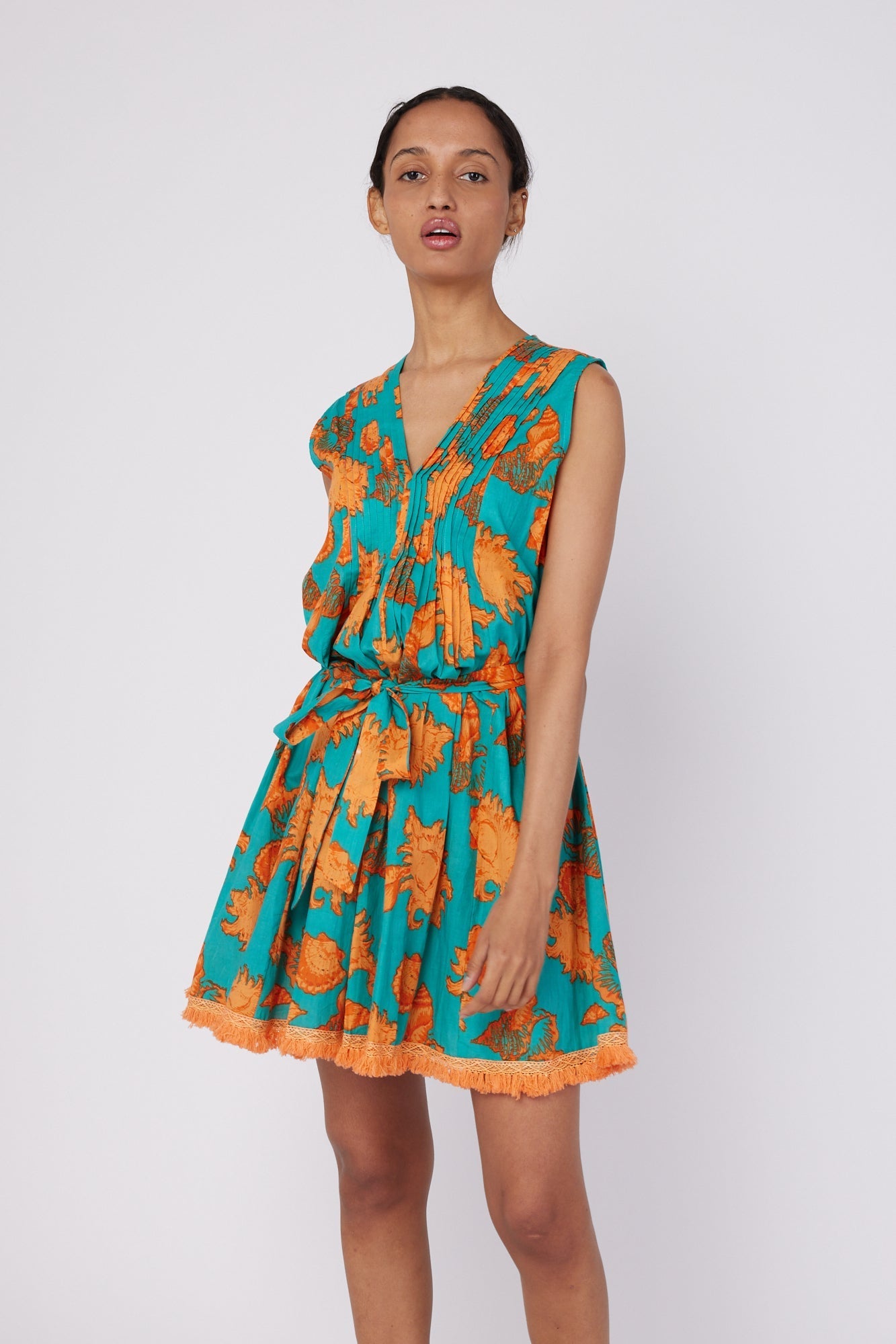 ModaPosa Felice Sleeveless V-Neck Puntuck Knee Length Dress with Detachable Belt in Turquoise Orange Shells . Discover women's resort dresses and lifestyle clothing inspired by the Mediterranean. Free worldwide shipping available!