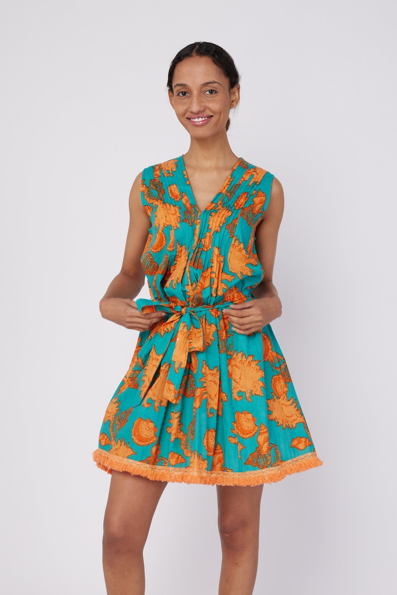 ModaPosa Felice Sleeveless V-Neck Puntuck Knee Length Dress with Detachable Belt in Turquoise Orange Shells . Discover women's resort dresses and lifestyle clothing inspired by the Mediterranean. Free worldwide shipping available!