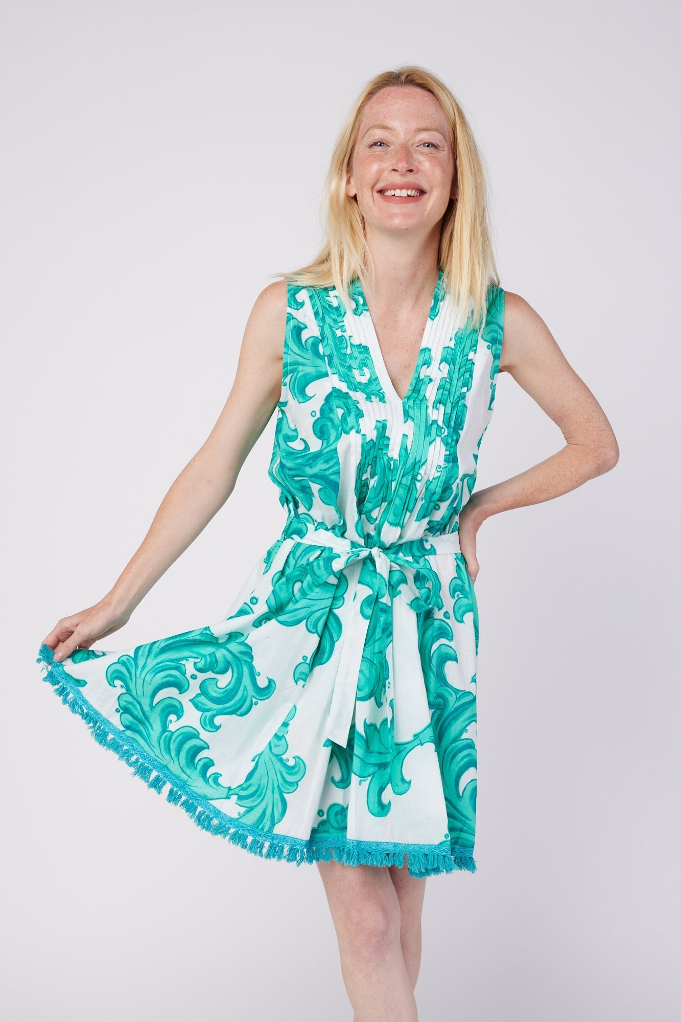 ModaPosa Felice Sleeveless V-Neck Puntuck Knee Length Dress with Detachable Belt in White Aqua Baroque . Discover women's resort dresses and lifestyle clothing inspired by the Mediterranean. Free worldwide shipping available!