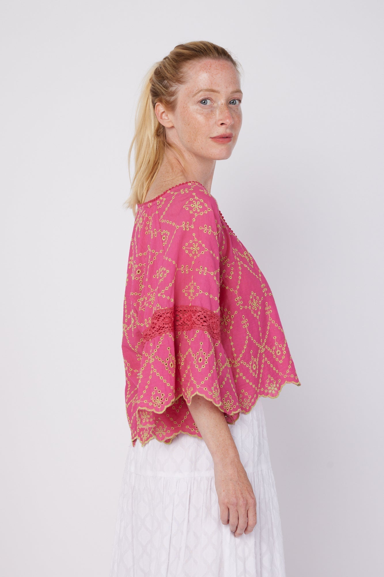 ModaPosa Vanna Short Bell Sleeve Hand Embroidered Eyelet Blouse in Sorbet . Discover women's resort dresses and lifestyle clothing inspired by the Mediterranean. Free worldwide shipping available!