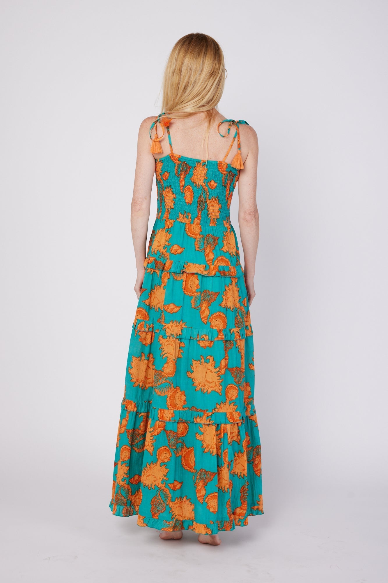 ModaPosa Dianora Spaghetti Strap Smocked Tiered Maxi Dress in Turquoise Orange Shells . Discover women's resort dresses and lifestyle clothing inspired by the Mediterranean. Free worldwide shipping available!