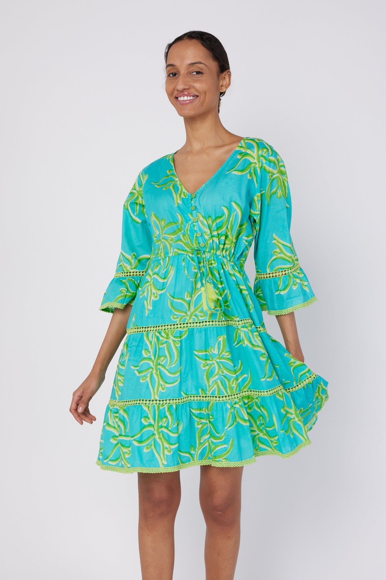 ModaPosa Desideria 3/4 Frill Sleeve Drawstring Empire Knee Length Dress in Green Abstract Flower . Discover women's resort dresses and lifestyle clothing inspired by the Mediterranean. Free worldwide shipping available!