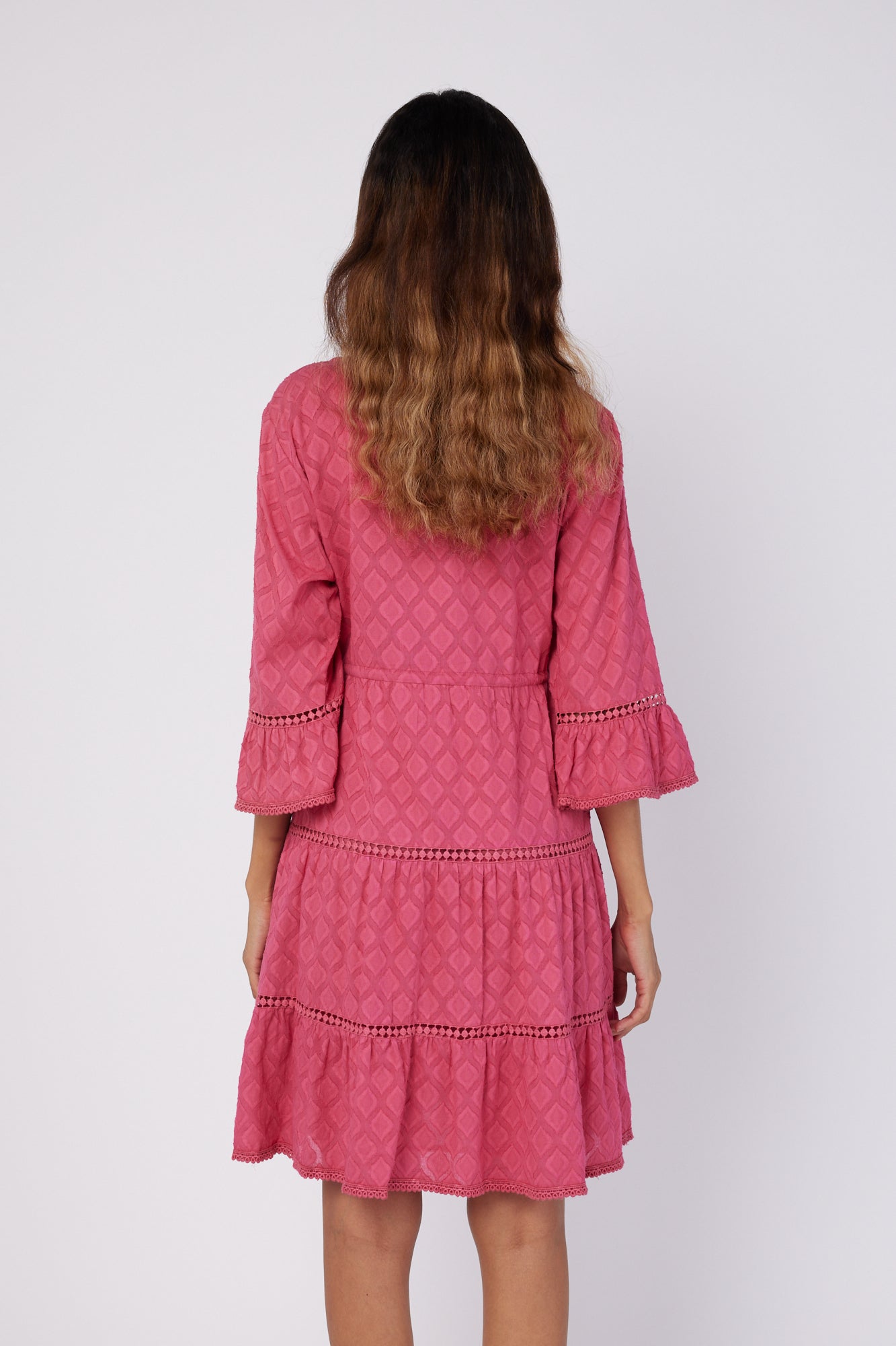 ModaPosa Desideria 3/4 Frill Sleeve Drawstring Empire Jacquard Knee Length Dress in Raspberry . Discover women's resort dresses and lifestyle clothing inspired by the Mediterranean. Free worldwide shipping available!