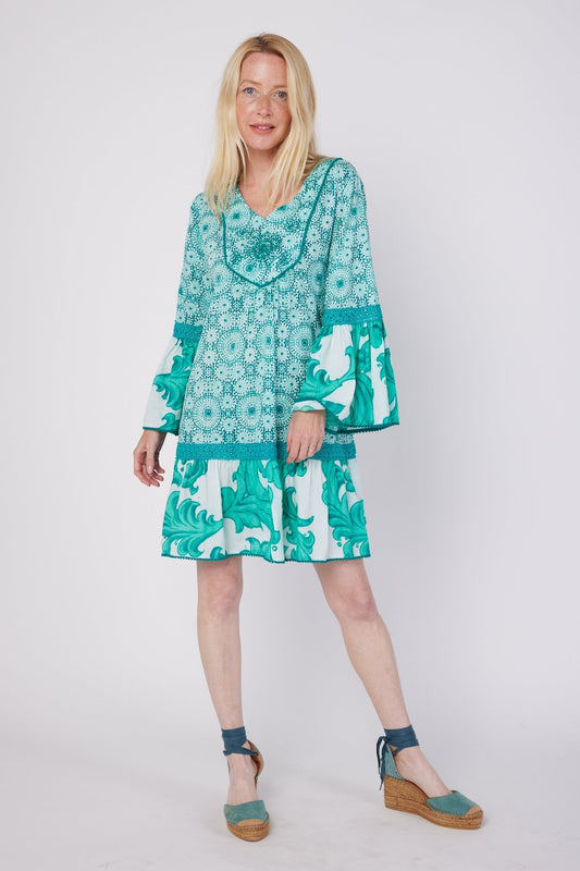 ModaPosa Ilaria 3/4 Flared Sleeve Drop Waist Hand Embroidered Knee Length Dress with Lace Trim in Green Swirl Combo . Discover women's resort dresses and lifestyle clothing inspired by the Mediterranean. Free worldwide shipping available!