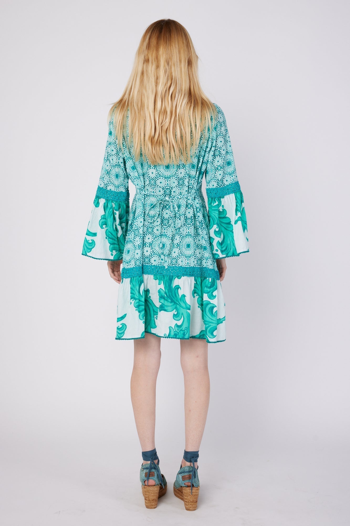 ModaPosa Ilaria 3/4 Flared Sleeve Drop Waist Hand Embroidered Knee Length Dress with Lace Trim in Green Swirl Combo . Discover women's resort dresses and lifestyle clothing inspired by the Mediterranean. Free worldwide shipping available!
