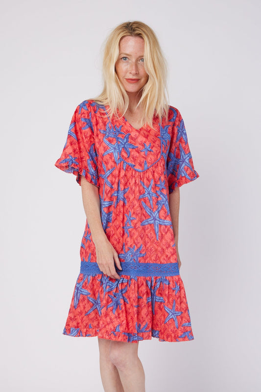 ModaPosa Ilaria Short Sleeve Drop Waist Hand Embroidered Knee Length Dress with Lace Trim in Starfish Scales . Discover women's resort dresses and lifestyle clothing inspired by the Mediterranean. Free worldwide shipping available!